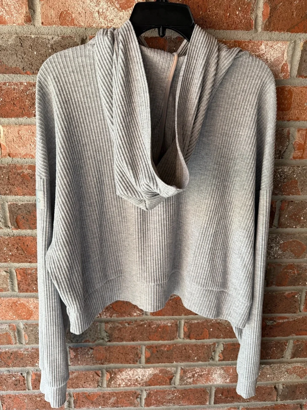 Alo Yoga Muse Hoodie in the color Athletic Heather Grey. Size large